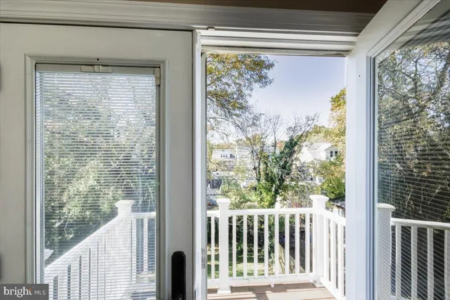 a living room with a fireplace and a window