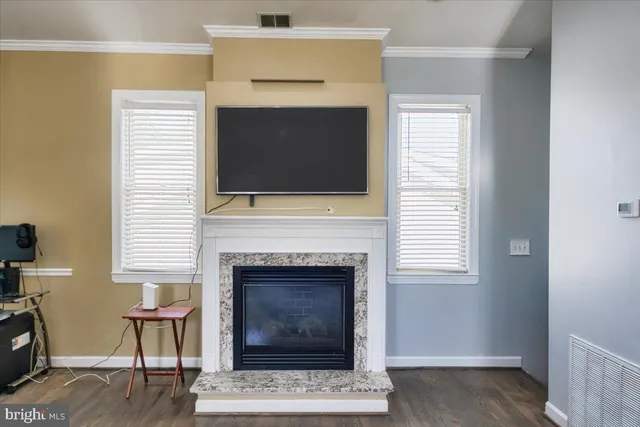 a view of a livingroom with lounge chair and a window