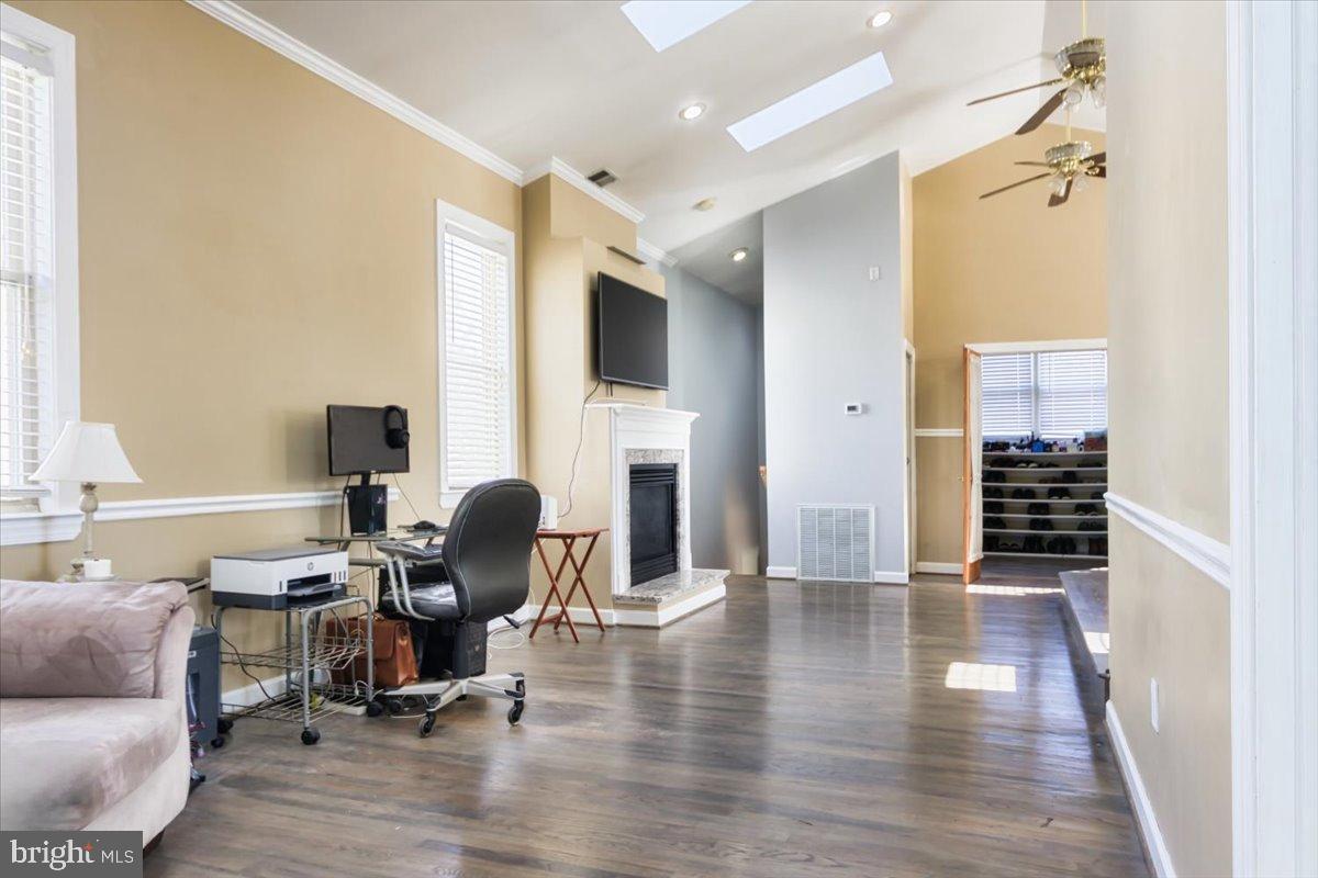 5306 Morello Road Baltimore, MD 21214 - Photo 29 of 37 a view of a workspace with furniture and a fireplace