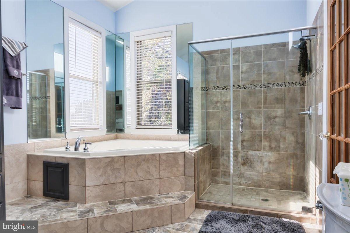 5306 Morello Road Baltimore, MD 21214 - Photo 32 of 37 a bathroom with a shower and a bathtub