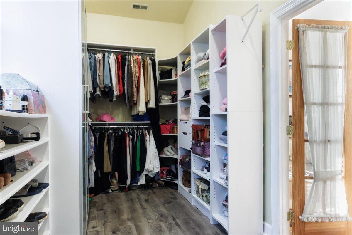 5306 Morello Road Baltimore, MD 21214 - Photo 33 of 37 a view of walk in closet with clothes and shoes