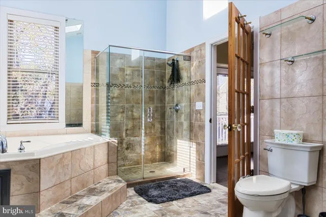 a bathroom with a shower and a bathtub
