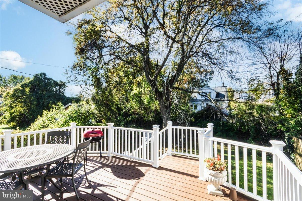 5306 Morello Road Baltimore, MD 21214 - Photo 34 of 37 a balcony with wooden floor and fence