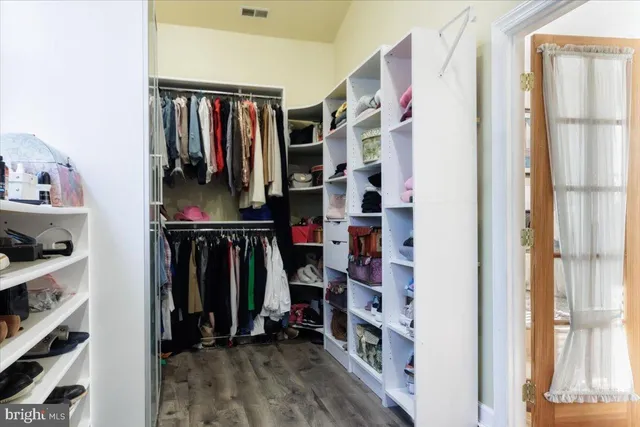 a balcony with wooden floor and fence