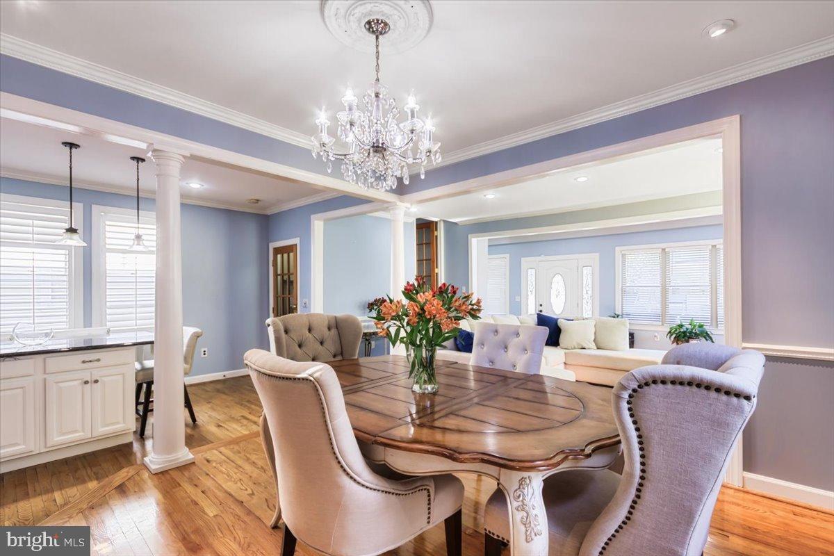 5306 Morello Road Baltimore, MD 21214 - Photo 8 of 37 a view of a dining room with furniture window and wooden floor