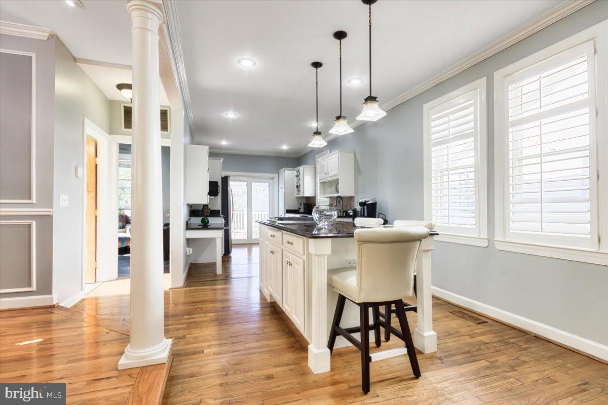 5306 Morello Road Baltimore, MD 21214 - Photo 9 of 37 a large kitchen with a table and chairs in it