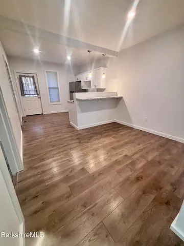 a view of kitchen with wooden floor