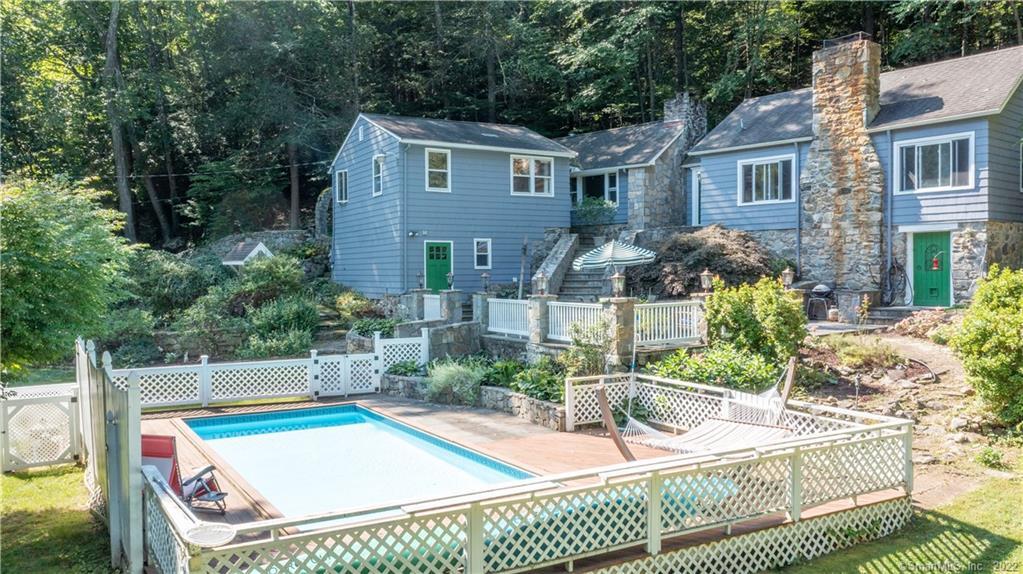 a view of house with a swimming pool