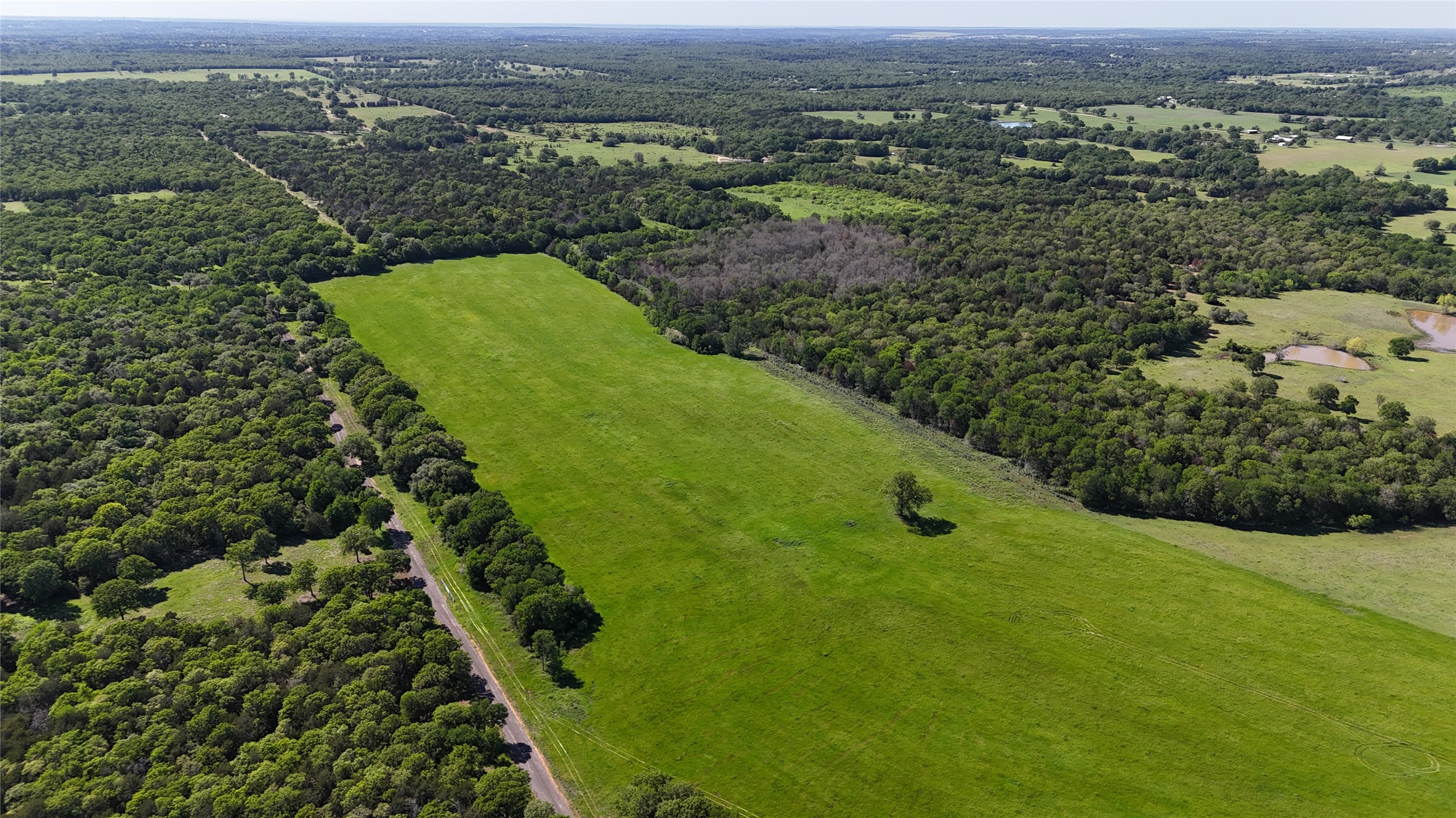 Tbd Tbd Street Paige, TX 78659 - Photo 11 of 14 Aerial overview of property's location with a heavily wooded area