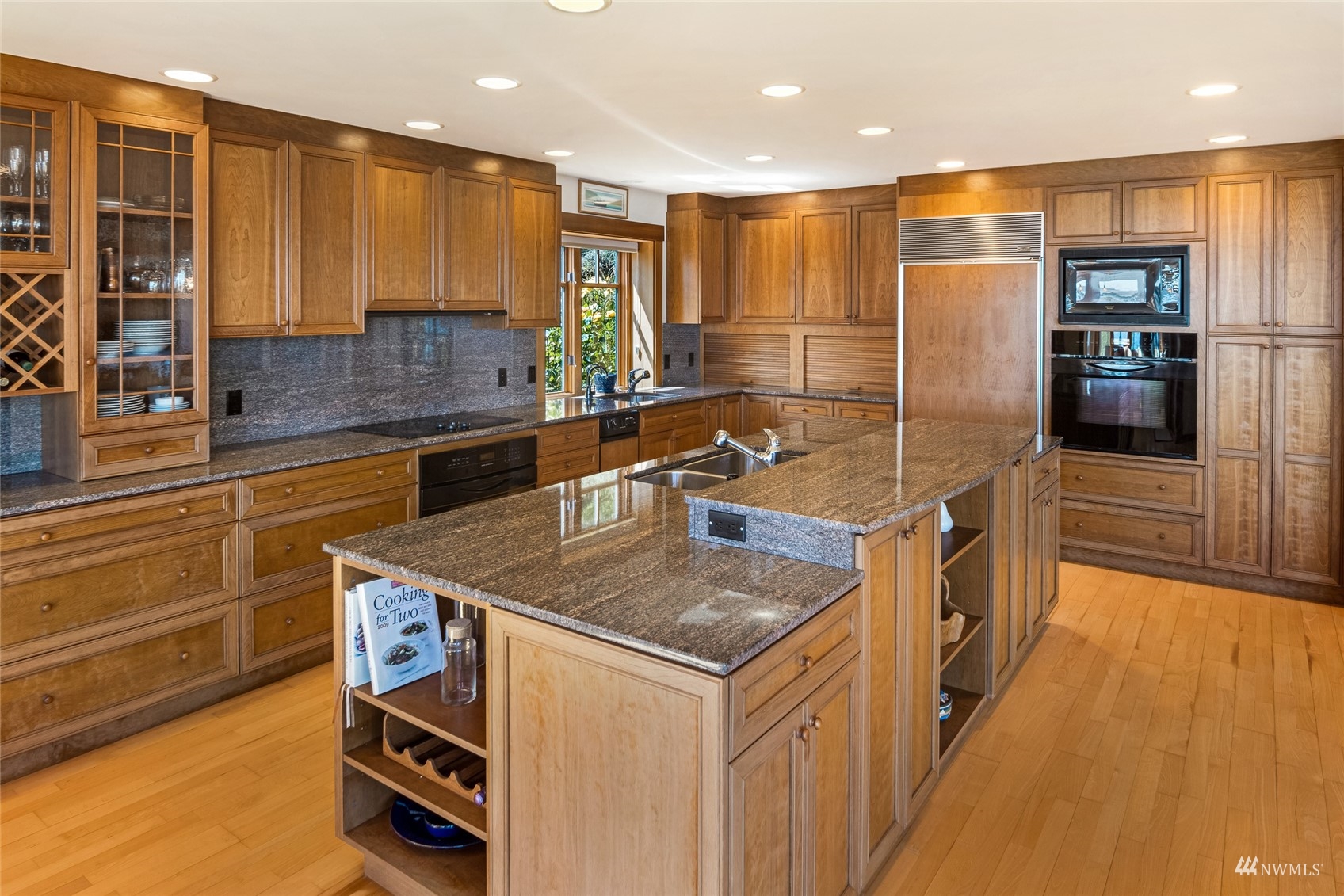3209 Pear Point Road Friday Harbor, WA 98250 - Photo 11 of 40 a kitchen with stainless steel appliances granite countertop a sink a stove and a refrigerator