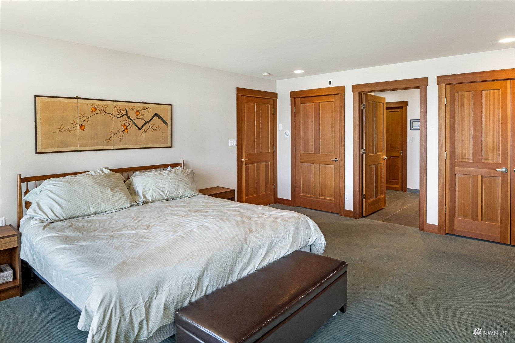 3209 Pear Point Road Friday Harbor, WA 98250 - Photo 18 of 40 a bedroom with a bed and cabinets