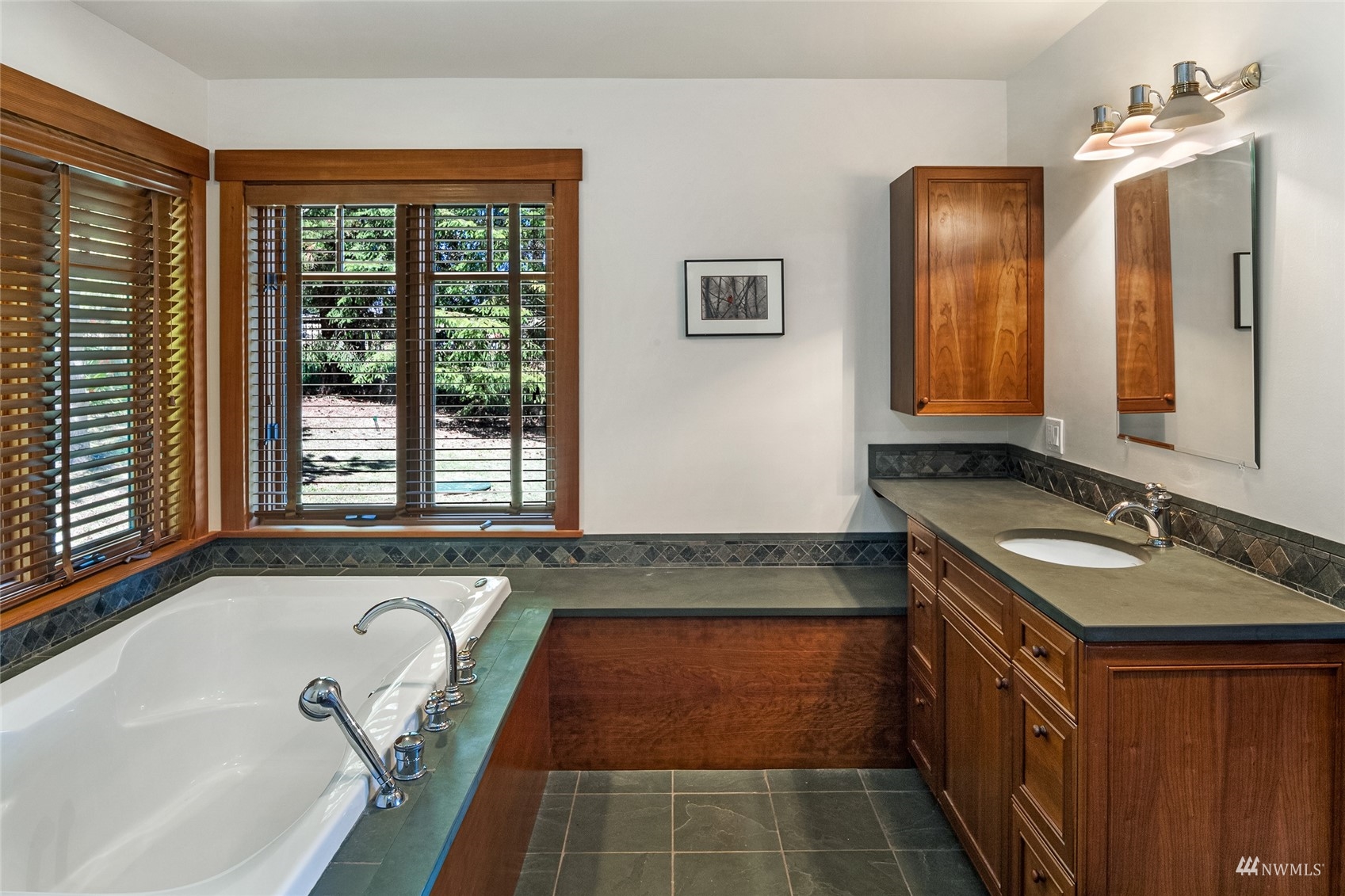 3209 Pear Point Road Friday Harbor, WA 98250 - Photo 19 of 40 a bathroom with a tub sink and mirror