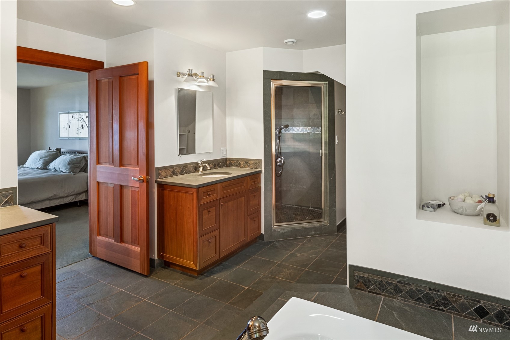3209 Pear Point Road Friday Harbor, WA 98250 - Photo 20 of 40 a kitchen with stainless steel appliances granite countertop a sink and a refrigerator