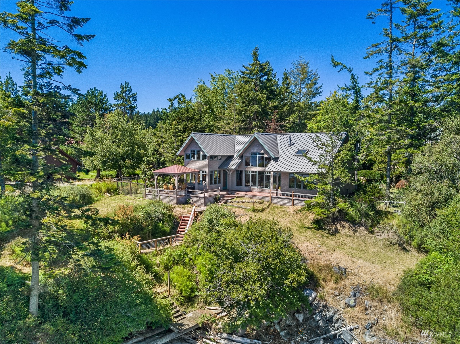 3209 Pear Point Road Friday Harbor, WA 98250 - Photo 2 of 40 a front view of a house with a yard