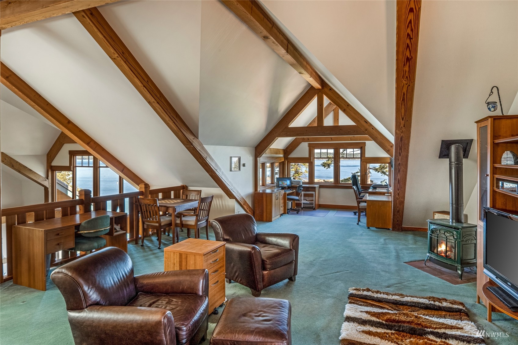 3209 Pear Point Road Friday Harbor, WA 98250 - Photo 25 of 40 a living room with furniture and a book shelf