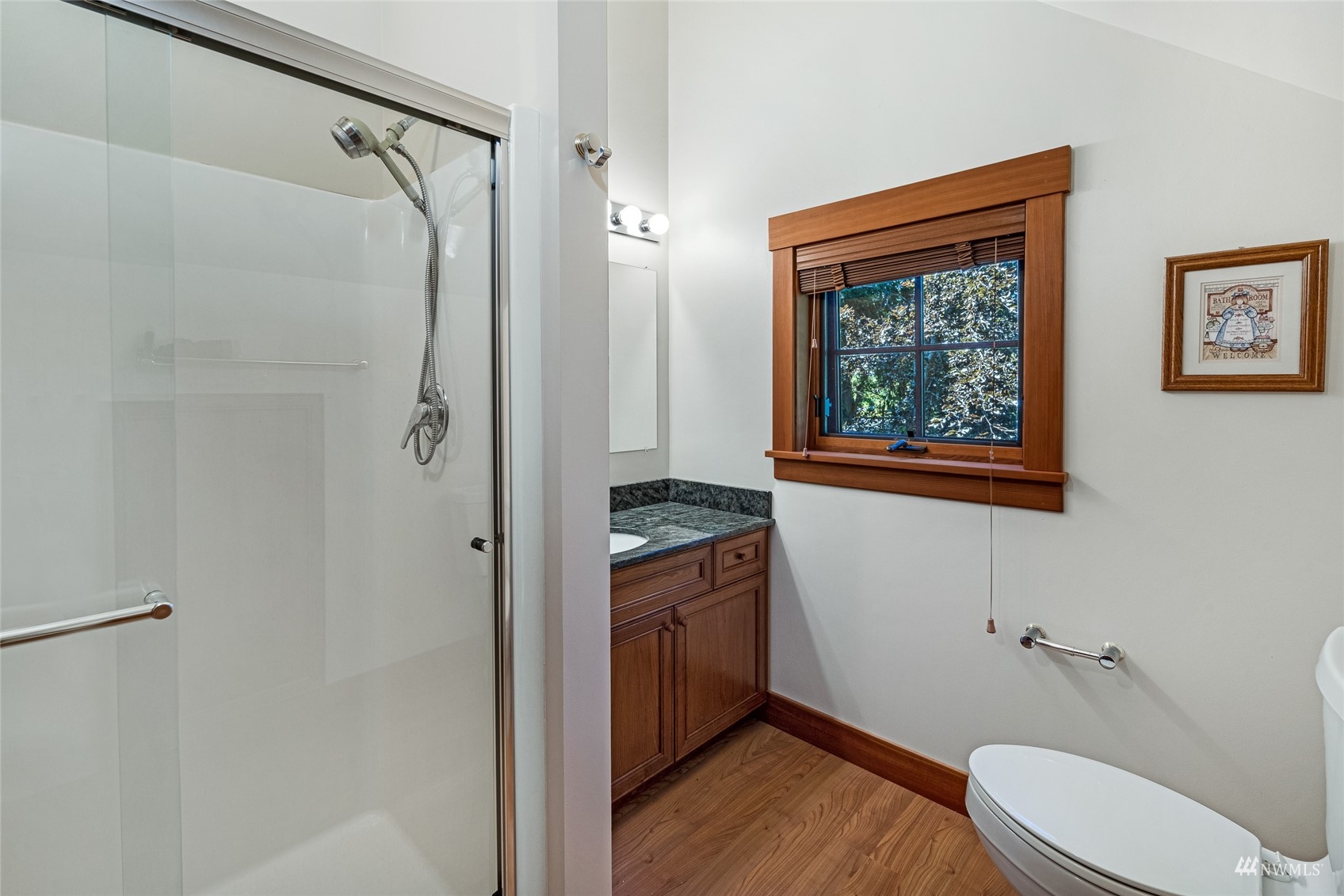 3209 Pear Point Road Friday Harbor, WA 98250 - Photo 29 of 40 a bathroom with a granite countertop toilet sink and shower