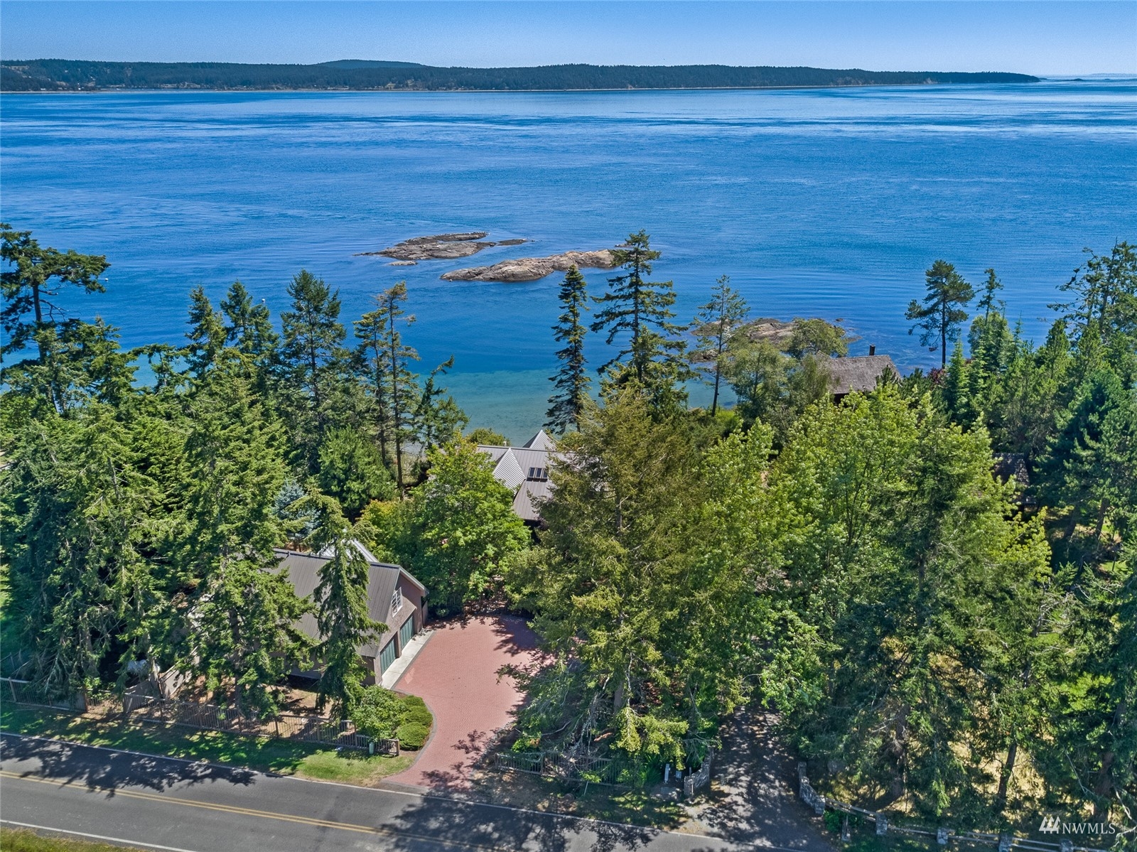 3209 Pear Point Road Friday Harbor, WA 98250 - Photo 31 of 40 a view of a lake with a yard
