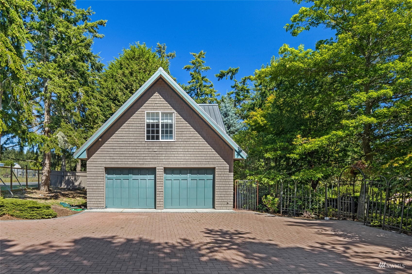 3209 Pear Point Road Friday Harbor, WA 98250 - Photo 32 of 40 a front view of a house with a garden