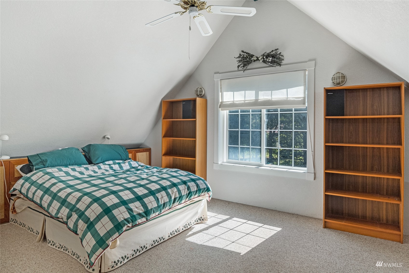 3209 Pear Point Road Friday Harbor, WA 98250 - Photo 33 of 40 a bedroom with a bed and a window