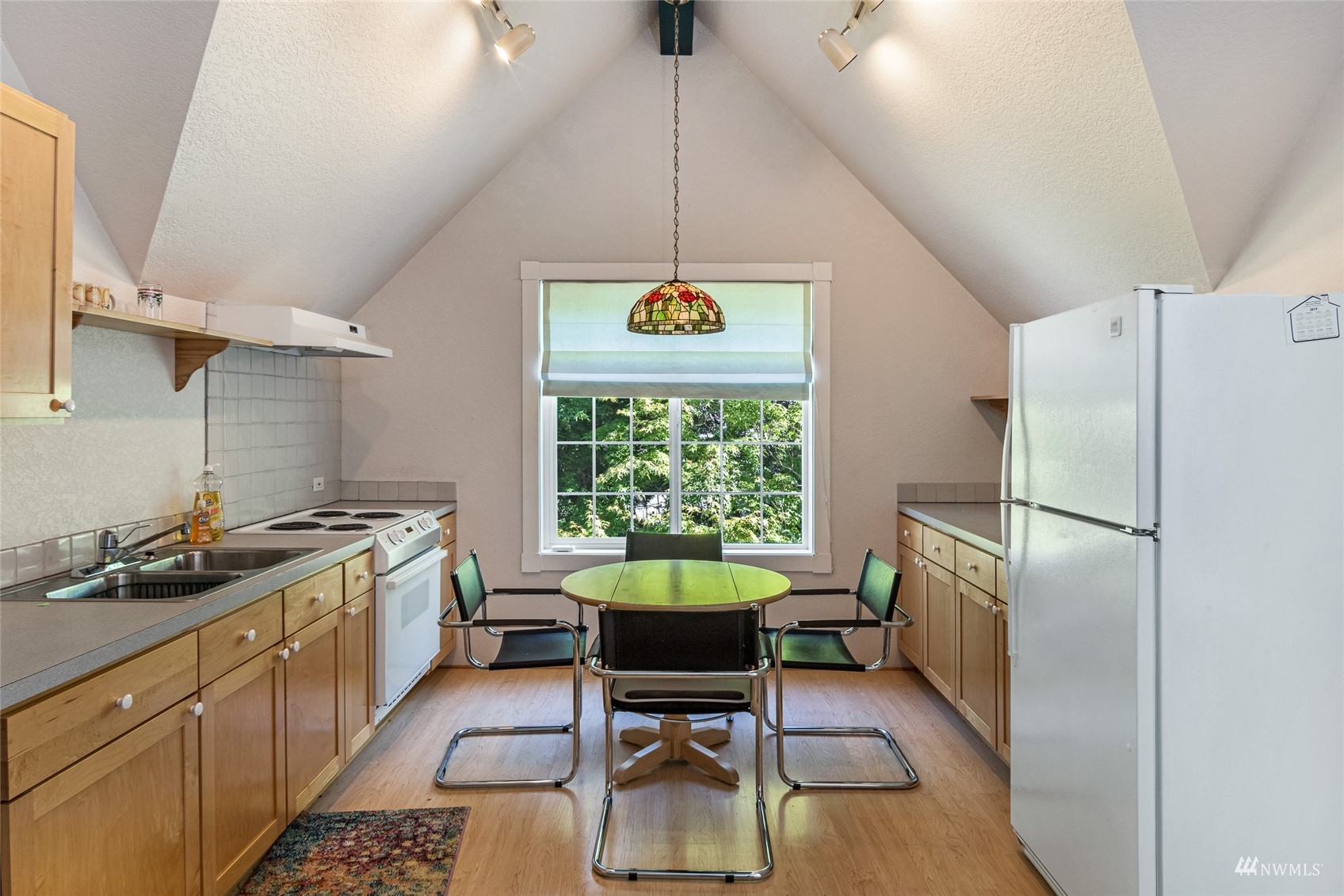 3209 Pear Point Road Friday Harbor, WA 98250 - Photo 34 of 40 a kitchen with a sink a refrigerator and a stove