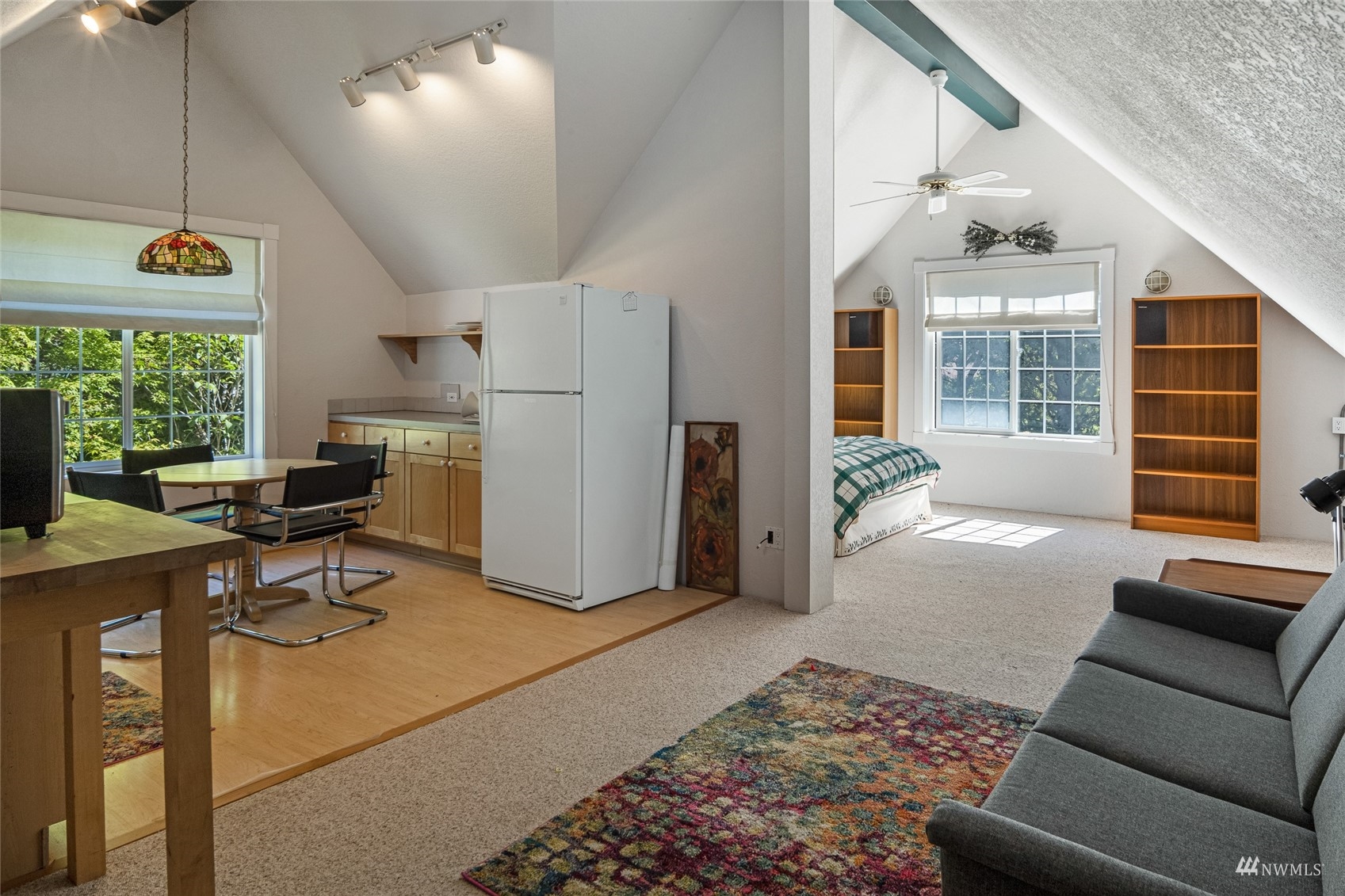 3209 Pear Point Road Friday Harbor, WA 98250 - Photo 35 of 40 a living room with furniture a dining table and a window