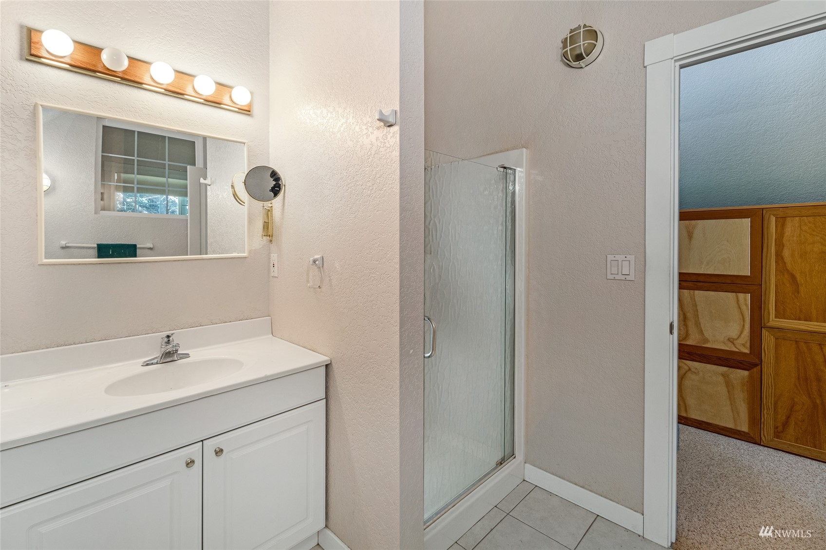 3209 Pear Point Road Friday Harbor, WA 98250 - Photo 36 of 40 a bathroom with a sink and a mirror