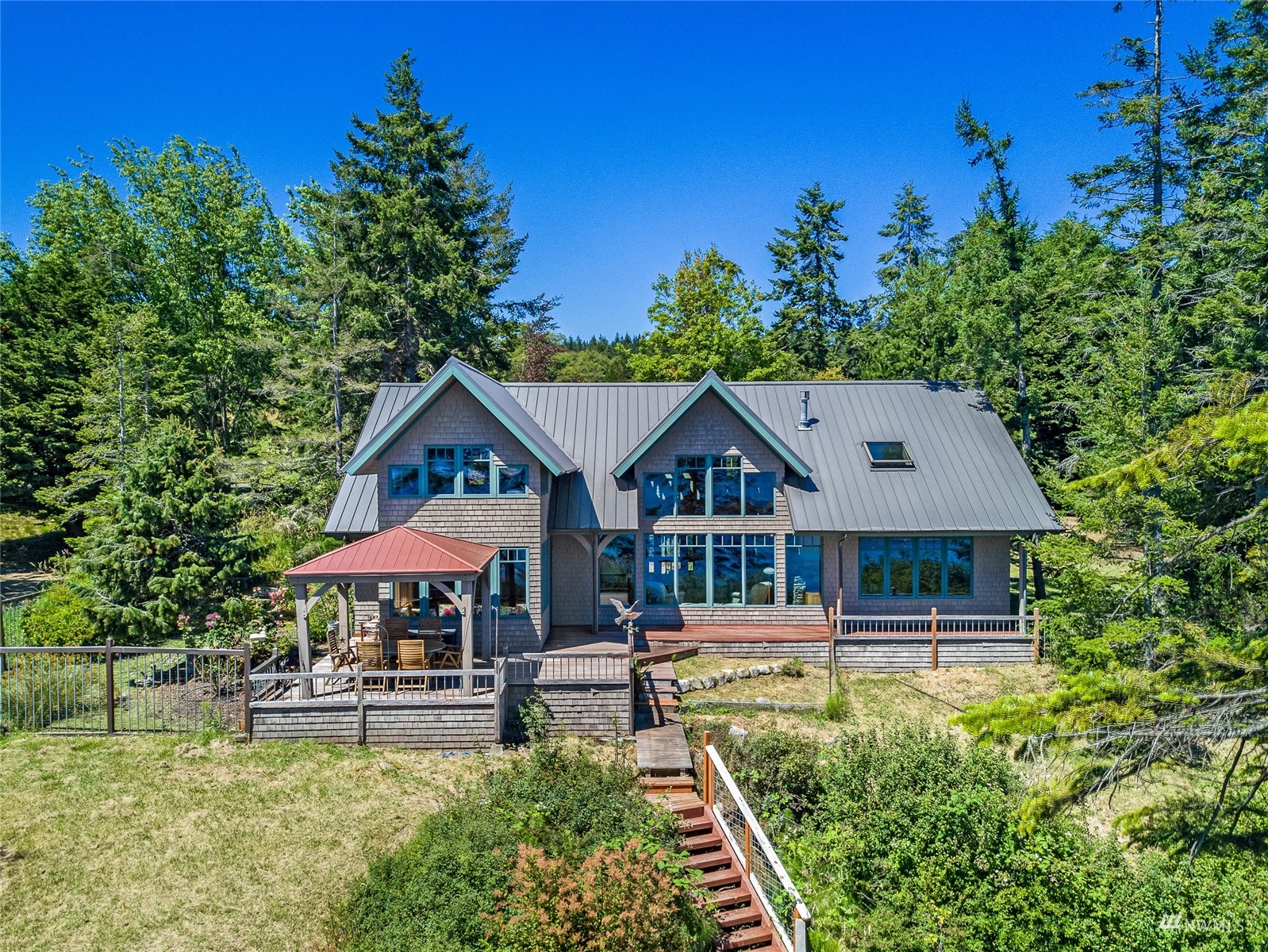3209 Pear Point Road Friday Harbor, WA 98250 - Photo 37 of 40 a front view of a house with garden