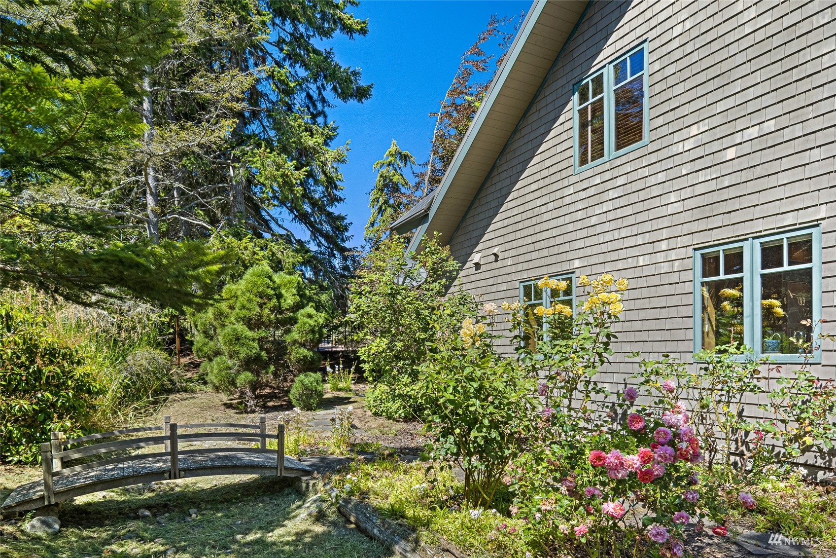 3209 Pear Point Road Friday Harbor, WA 98250 - Photo 38 of 40 a house with a flower garden