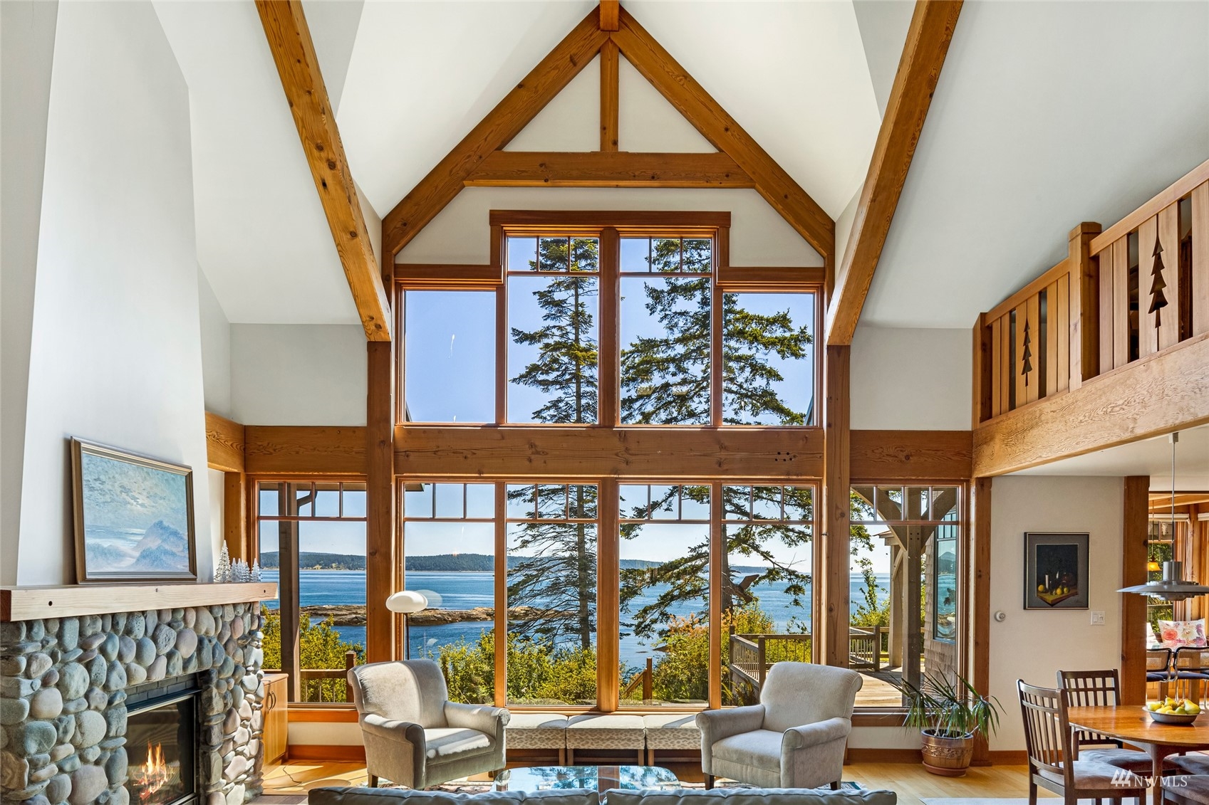 3209 Pear Point Road Friday Harbor, WA 98250 - Photo 7 of 40 a living room with large windows and furniture