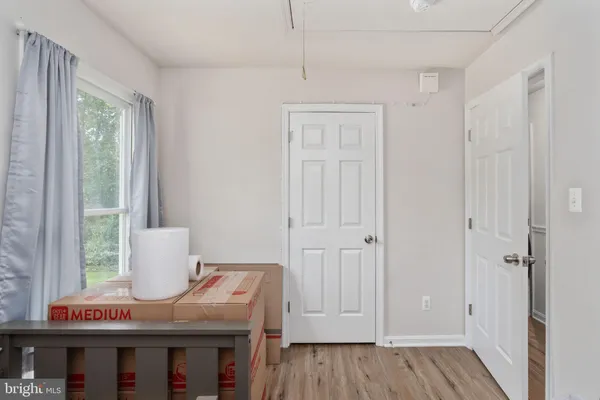 a room that has a window and a table in it