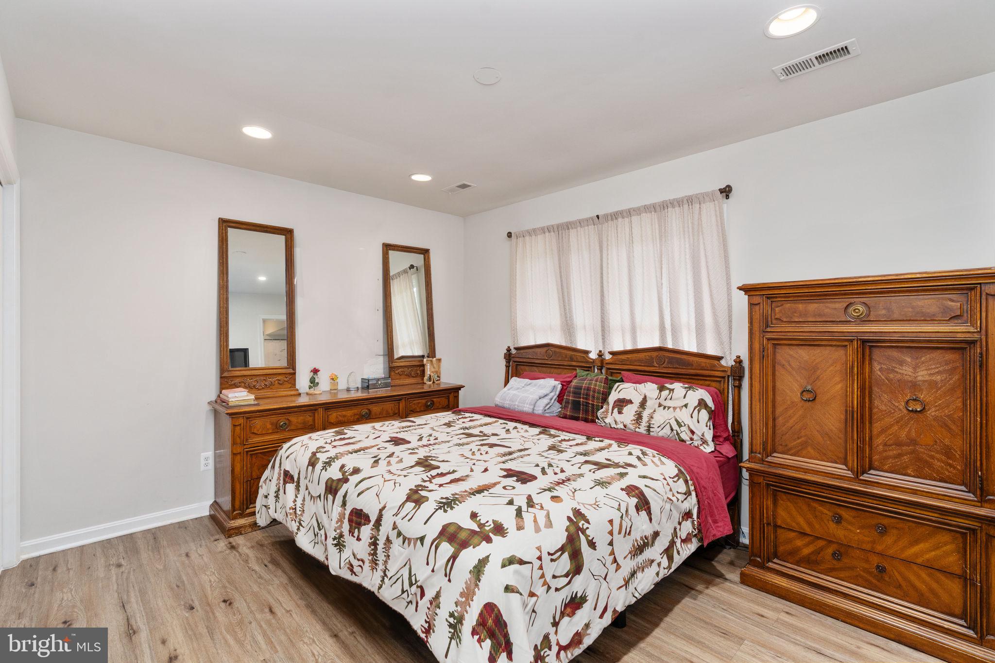 29315 Sparta Road Milford, VA 22514 - Photo 20 of 28 a bedroom with a bed and wooden floor