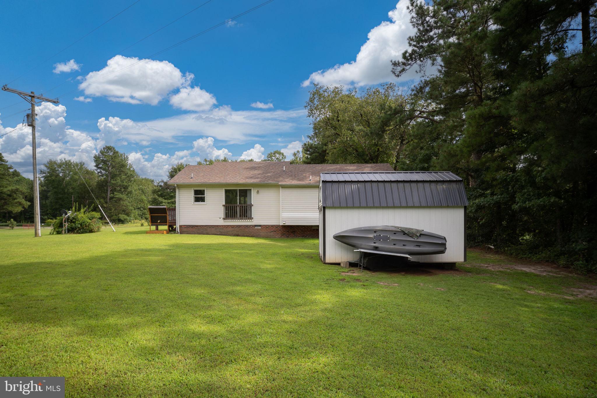 29315 Sparta Road Milford, VA 22514 - Photo 25 of 28 a view of a house with backyard