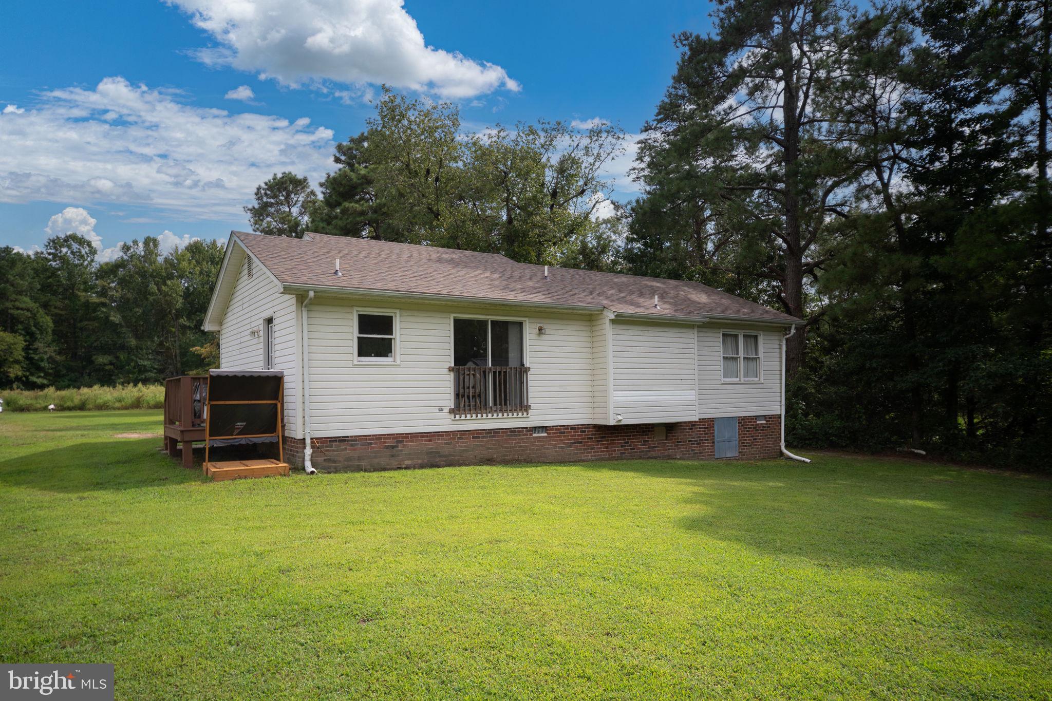 29315 Sparta Road Milford, VA 22514 - Photo 26 of 28 a view of a house with a yard and sitting area