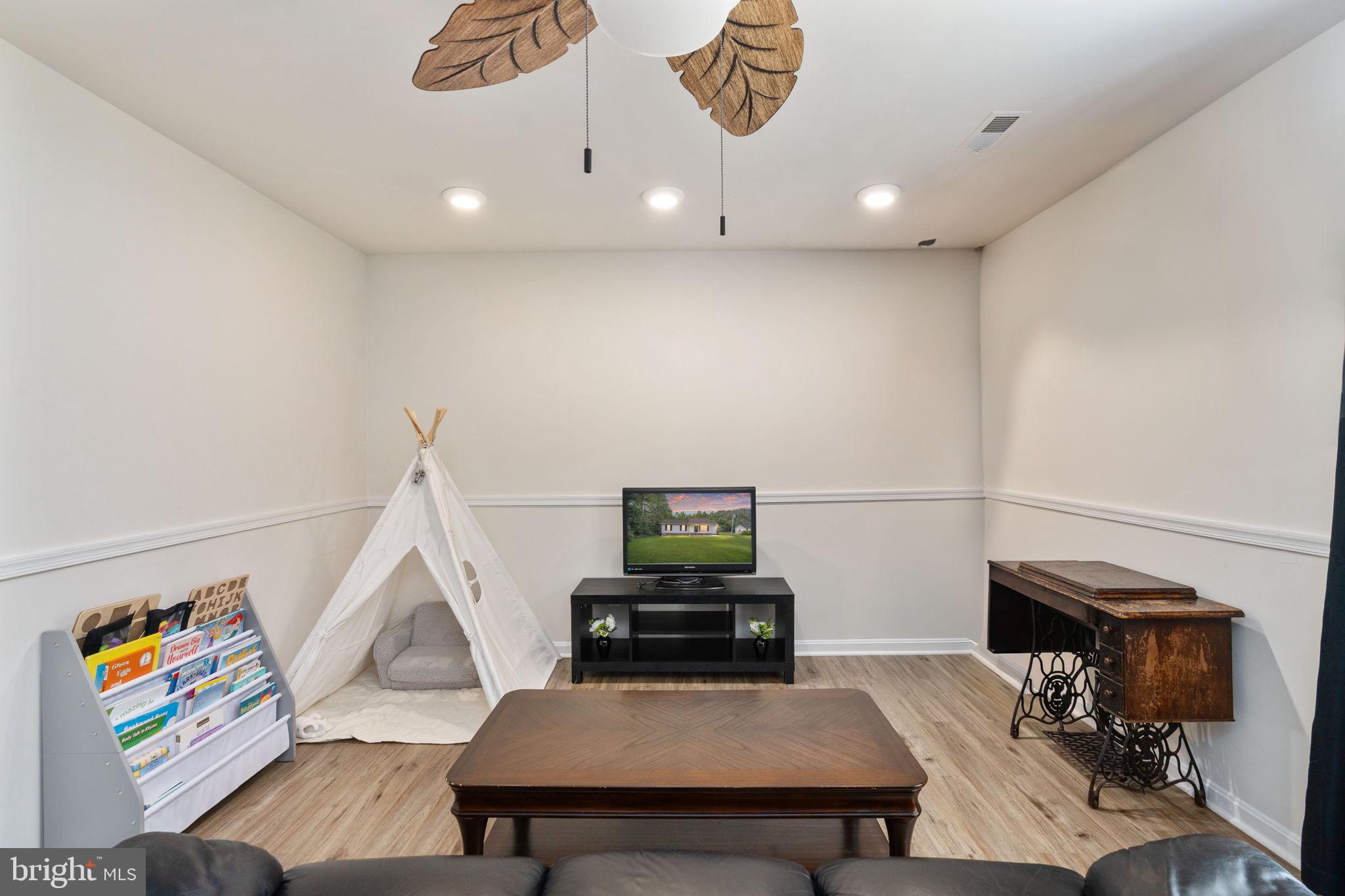 29315 Sparta Road Milford, VA 22514 - Photo 4 of 28 a living room with furniture and a wooden floor