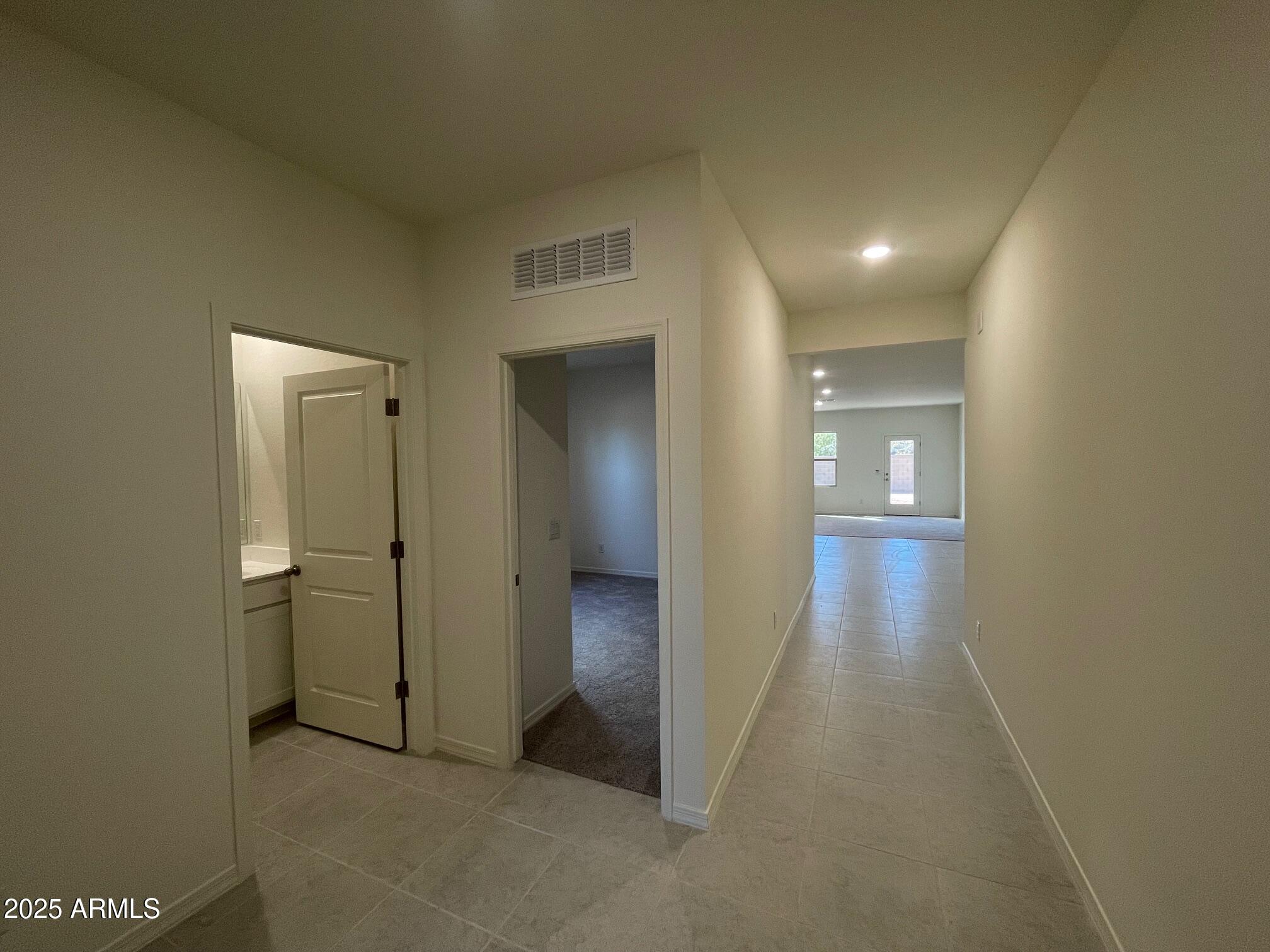5642 East Iris Drive Florence, AZ 85132 - Photo 11 of 13 an empty room with closet and mirror