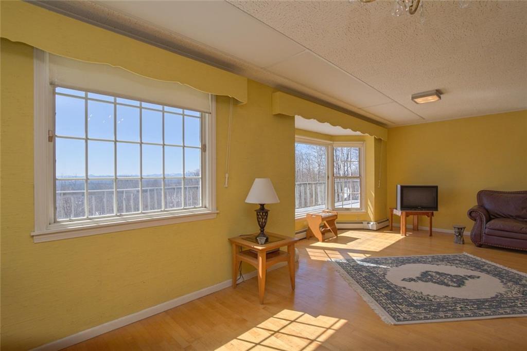 978 Buckfield Road South Paris, ME 04281 - Photo 11 of 31 Living room, bright and sunny facing...