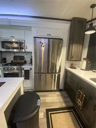 a kitchen with a stove and a microwave