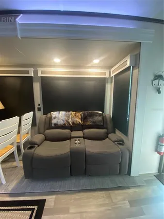 a bathroom with a sink a toilet a mirror and shower