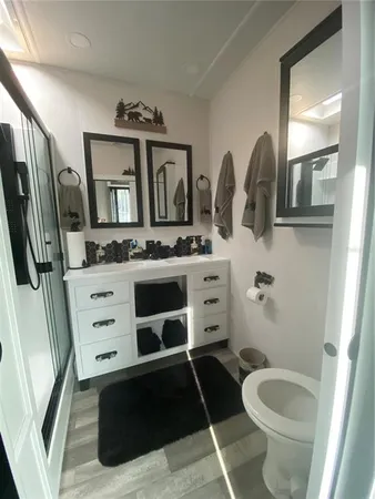 a bathroom with a double vanity sink and mirror