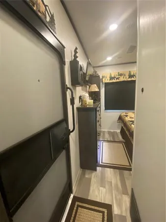 a kitchen with a sink a counter top space cabinets and stainless steel appliances