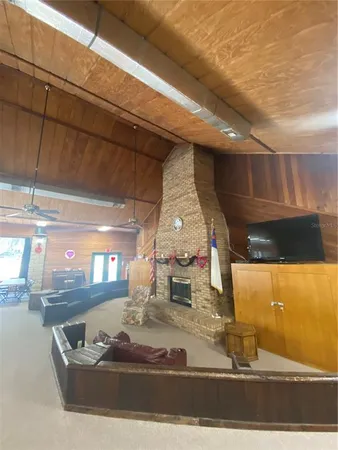 a living room with lots of furniture and a wooden floor