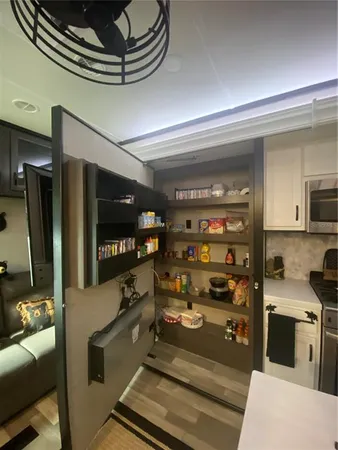 a kitchen with a stove and a refrigerator