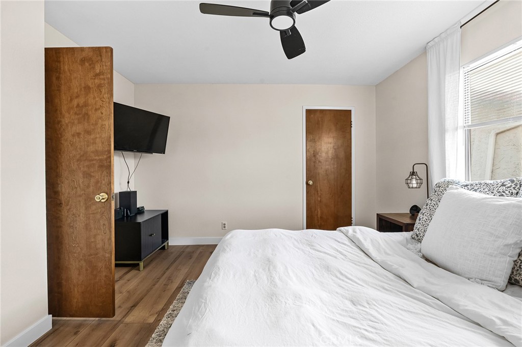 1261 Parque Drive Chico, CA 95926 - Photo 19 of 45 a bedroom with a bed and a flat tv screen on wall
