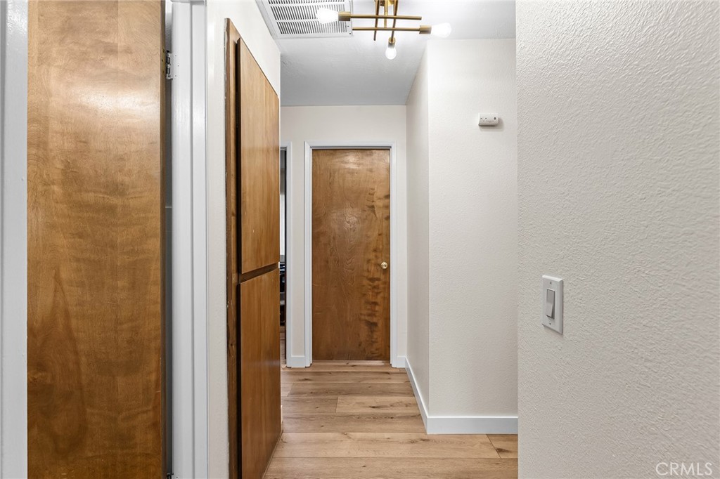 1261 Parque Drive Chico, CA 95926 - Photo 26 of 45 a view of a hallway with wooden floor