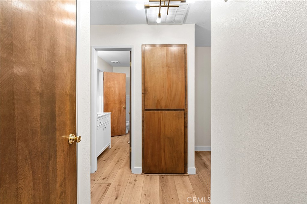 1261 Parque Drive Chico, CA 95926 - Photo 27 of 45 a view of a hallway with wooden floor
