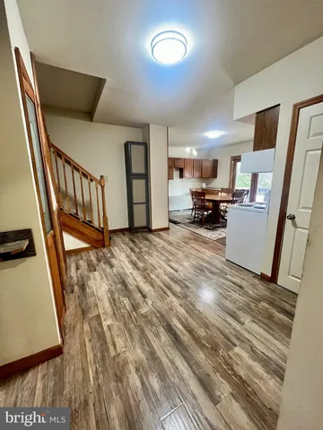 a bathroom with a toilet a sink and shower