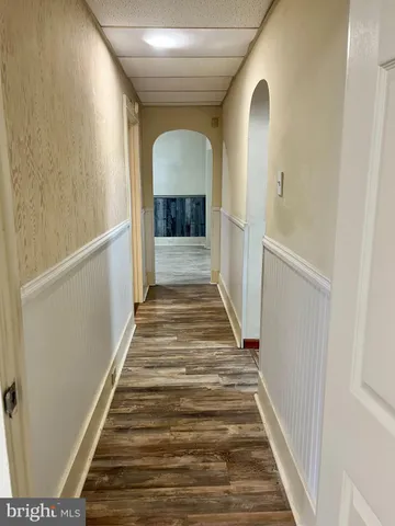 a view of wooden floor and cabinet in a room