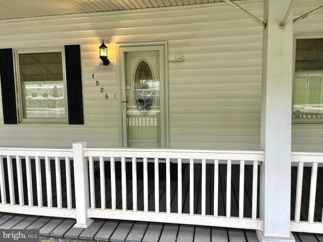 a view of a balcony with wooden floor