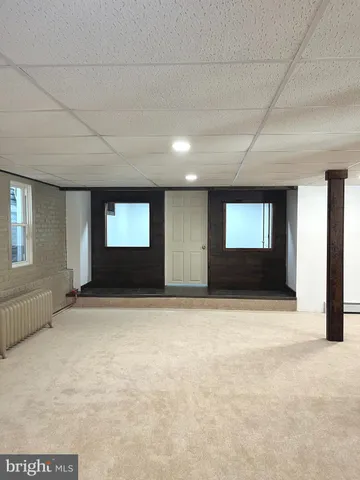 a balcony with table and chairs