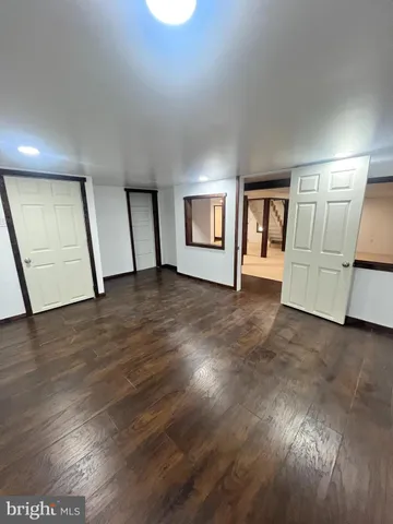 a view of a field with an trees in the background